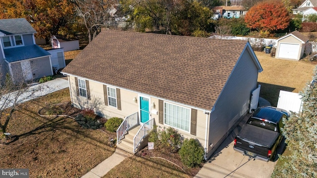 view of front of property featuring an outbuilding and a garage