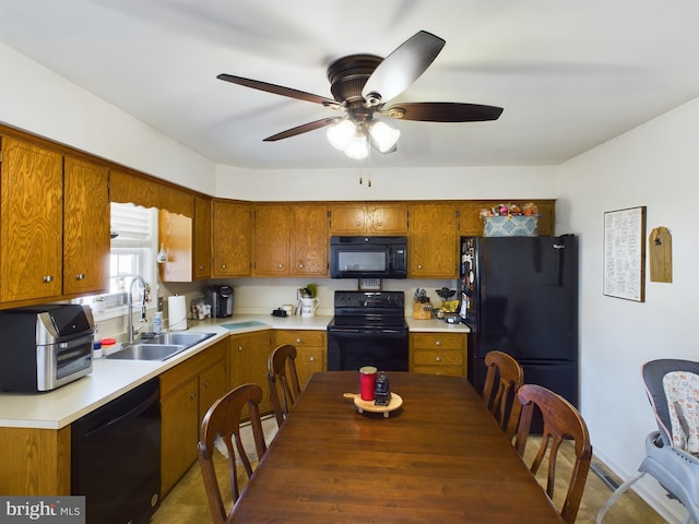 kitchen featuring ceiling fan, sink, and black appliances