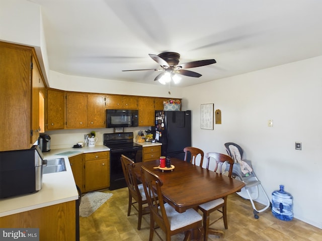 kitchen with ceiling fan and black appliances