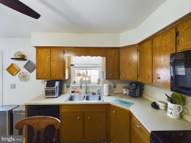 kitchen with sink and black appliances