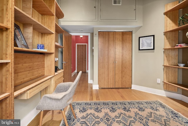 home office with light wood-type flooring