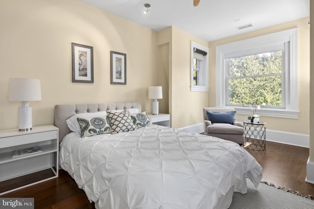 bedroom featuring dark wood-type flooring