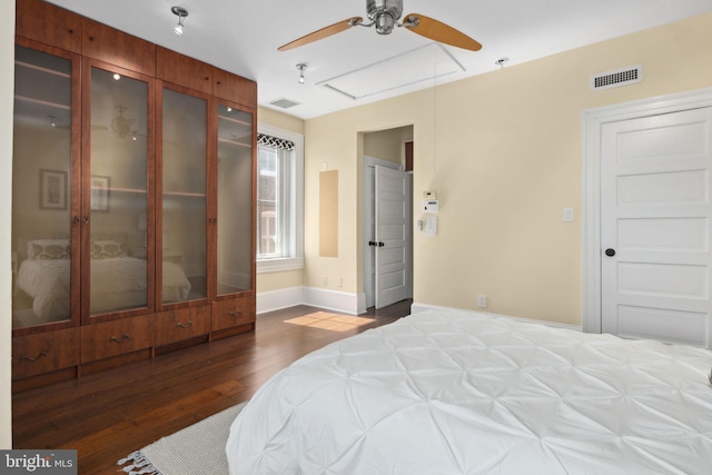 bedroom featuring ceiling fan and dark hardwood / wood-style floors