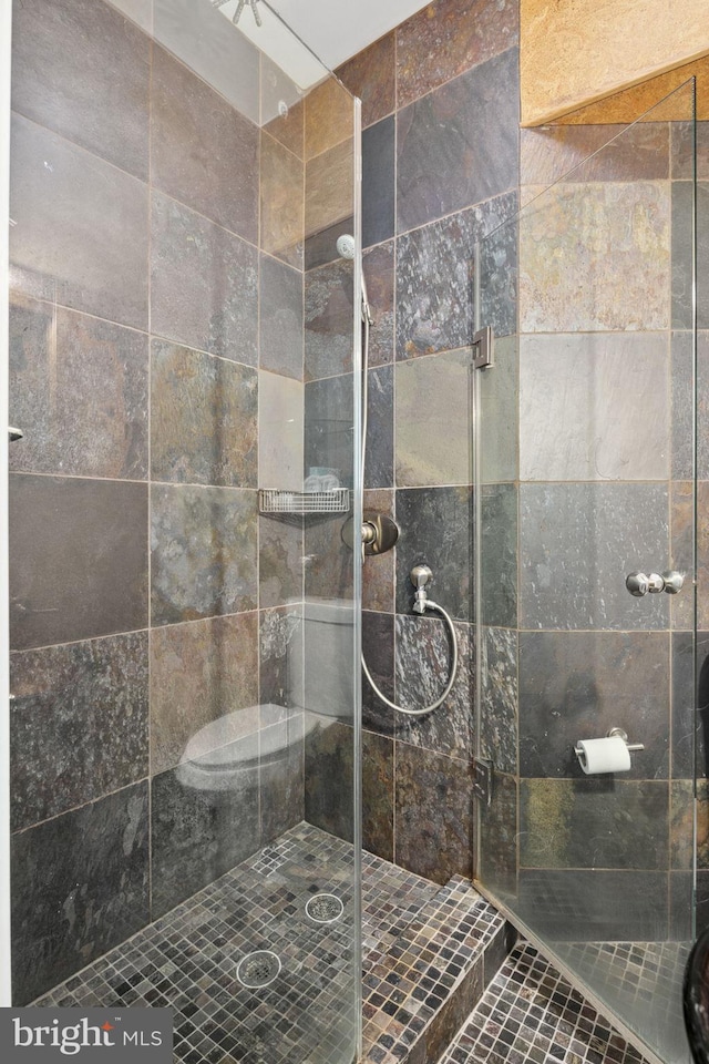 bathroom featuring an enclosed shower