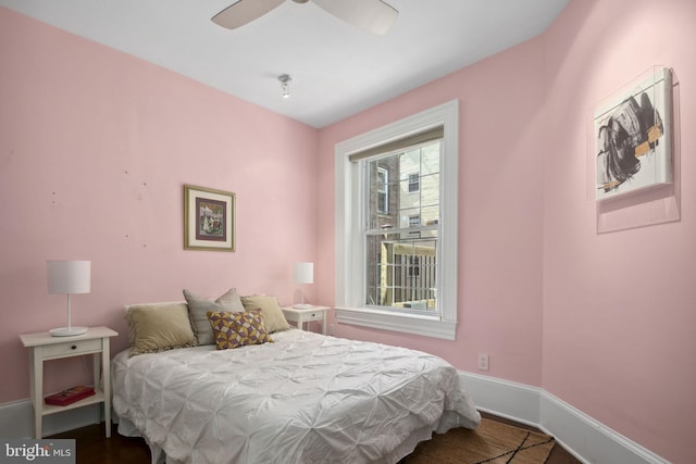 bedroom with hardwood / wood-style flooring and ceiling fan