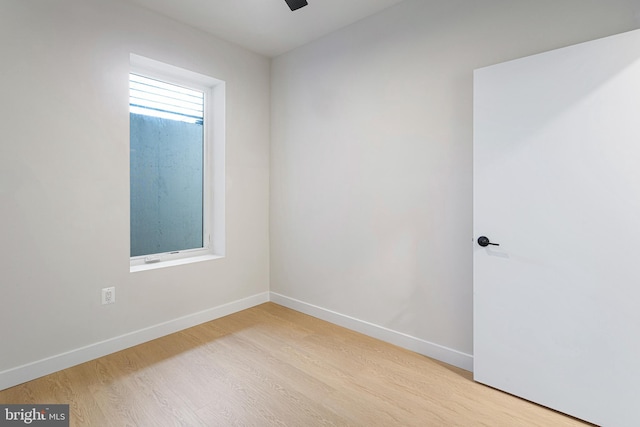 unfurnished room with light wood-type flooring