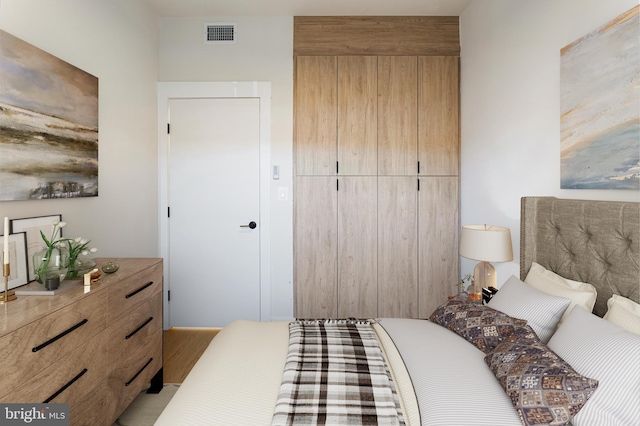 bedroom with light hardwood / wood-style flooring