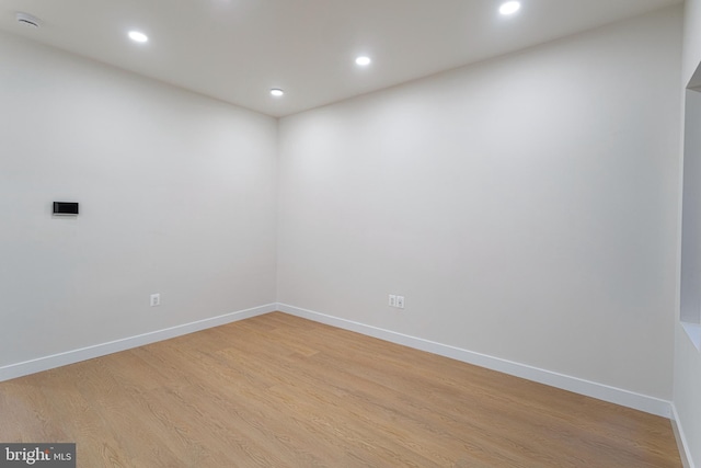 spare room with light hardwood / wood-style flooring