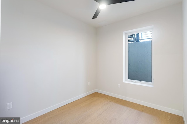 spare room with ceiling fan and light hardwood / wood-style flooring