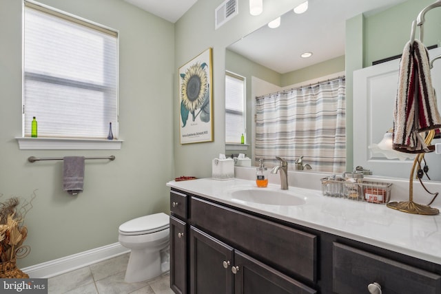 bathroom featuring tile patterned floors, vanity, and toilet