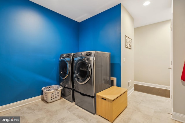 laundry room featuring washing machine and dryer