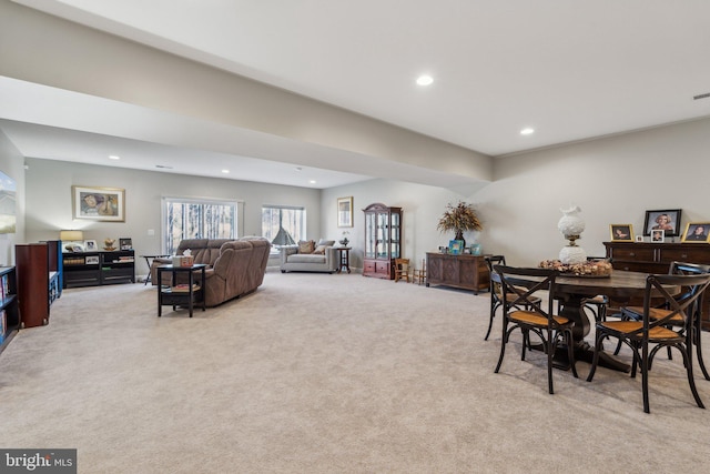 dining area with light colored carpet