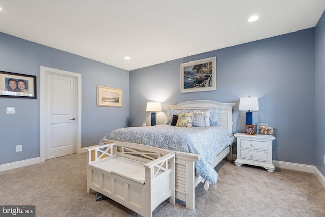 bedroom featuring light carpet