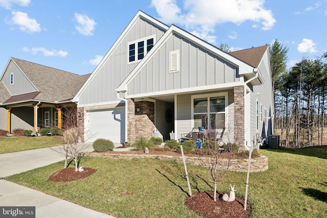 view of front of home with covered porch, central AC, and a front lawn