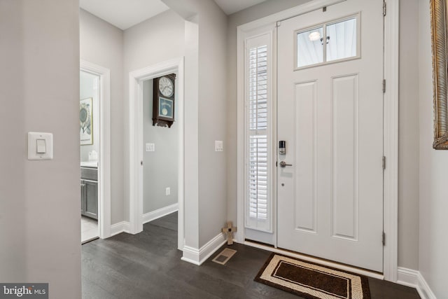 foyer entrance featuring dark hardwood / wood-style floors