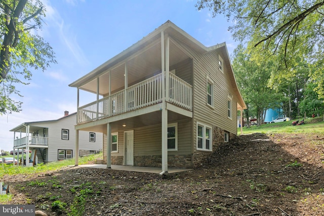 rear view of house featuring a patio