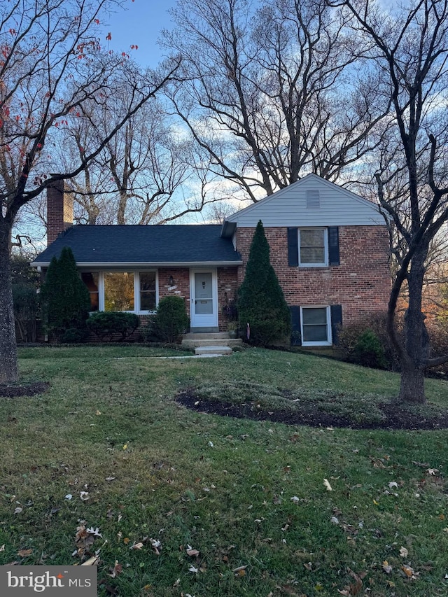 view of front of home with a front yard