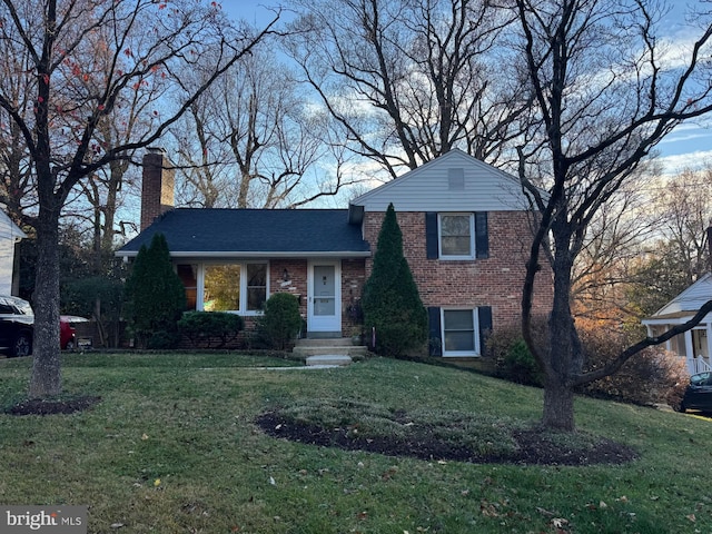 split level home with a front yard