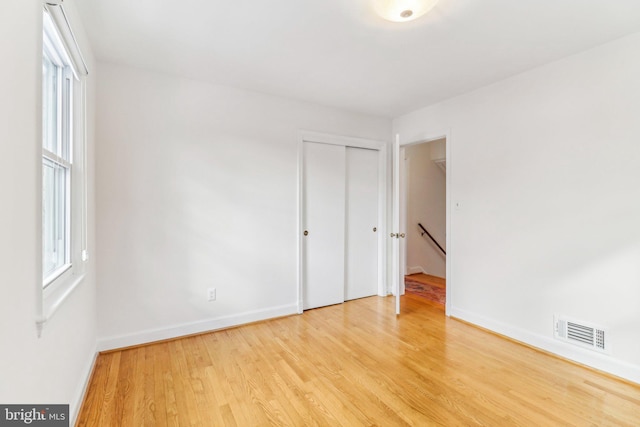 empty room with light wood-type flooring