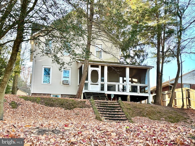 view of front of home with a sunroom