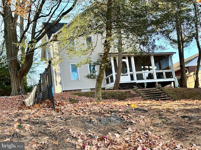 rear view of house with a sunroom