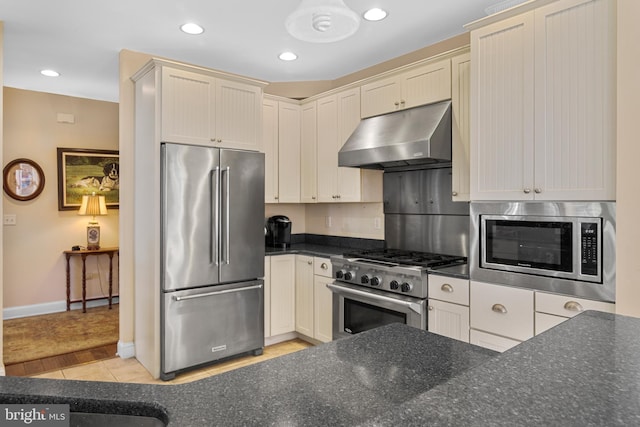 kitchen featuring light wood-type flooring and premium appliances