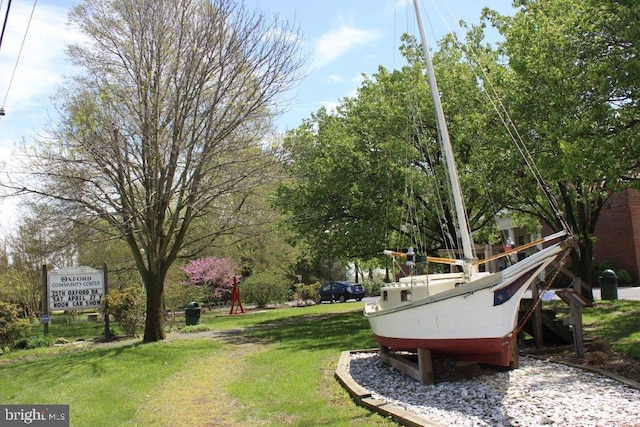 view of property's community with a yard