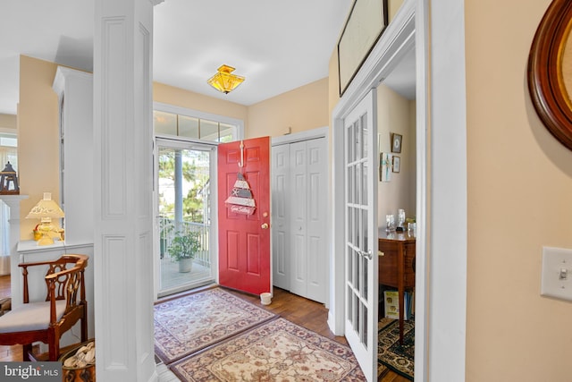 entryway with french doors and wood-type flooring