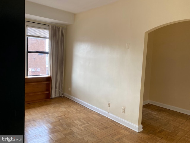 spare room featuring light parquet flooring