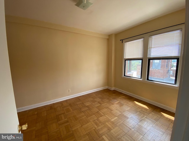 unfurnished room featuring light parquet flooring