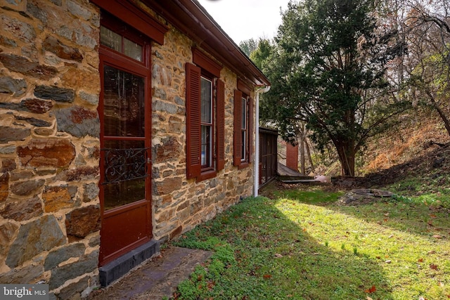 view of home's exterior featuring a lawn