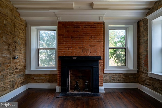 unfurnished living room featuring dark hardwood / wood-style floors and a large fireplace