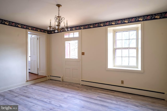 foyer featuring a chandelier, a baseboard radiator, and light hardwood / wood-style floors