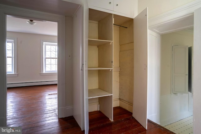 closet featuring a baseboard heating unit