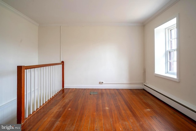 unfurnished room with dark hardwood / wood-style floors, ornamental molding, and a baseboard heating unit