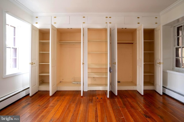 closet with a baseboard heating unit