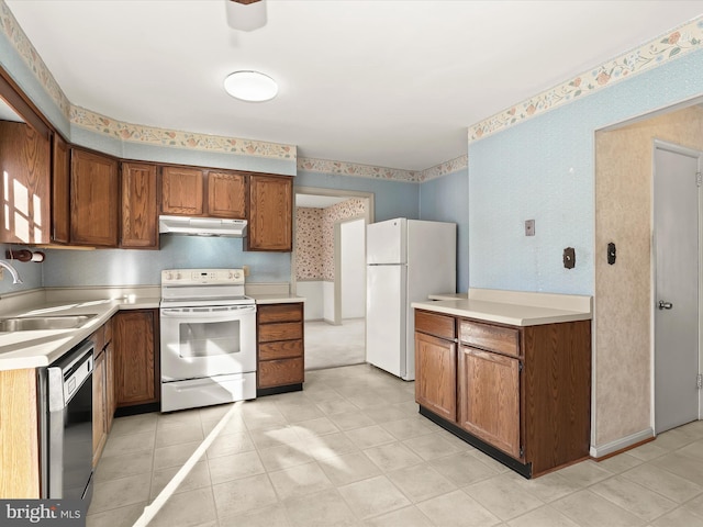 kitchen with sink and white appliances