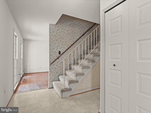 stairway featuring tile patterned floors