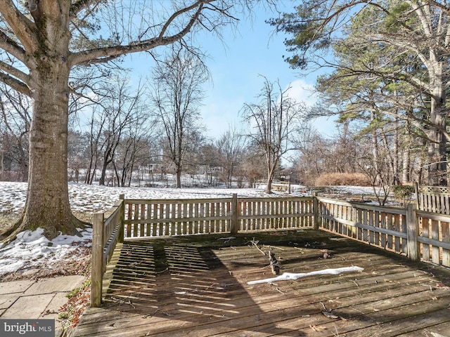 view of snow covered deck