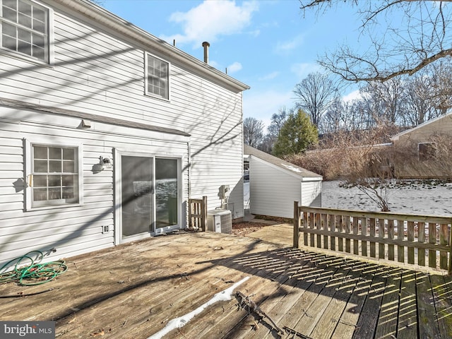 deck featuring central AC and a shed