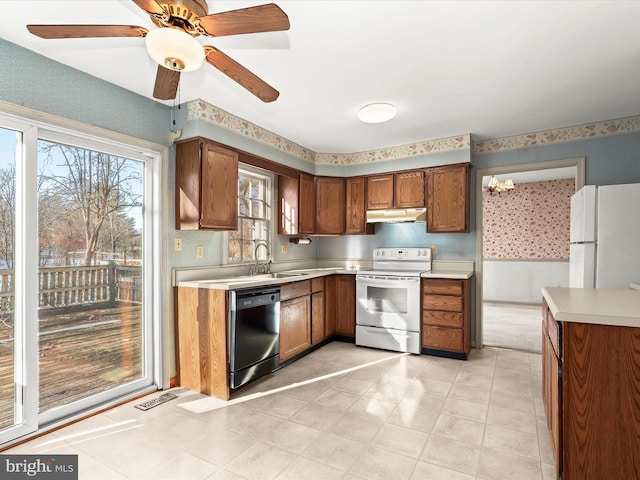 kitchen with sink and white appliances