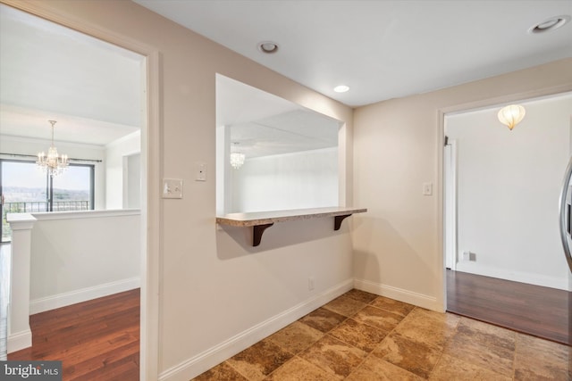 laundry room with a notable chandelier