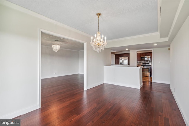 unfurnished room featuring a notable chandelier, crown molding, and dark hardwood / wood-style floors