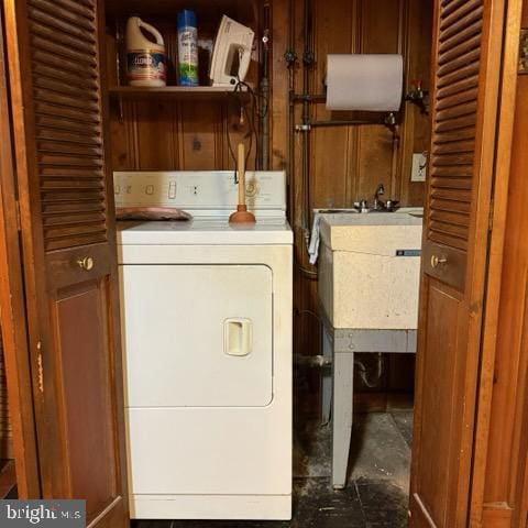 laundry room with a sink and washer / dryer