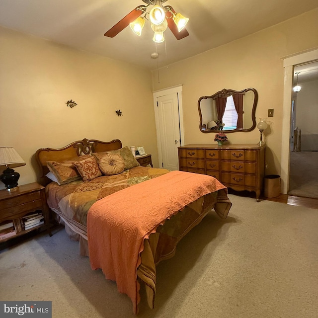 carpeted bedroom with a ceiling fan