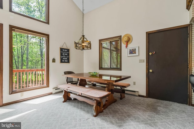 dining room featuring carpet flooring, high vaulted ceiling, and a baseboard radiator