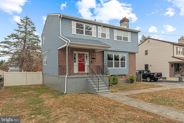 front facade with a front lawn