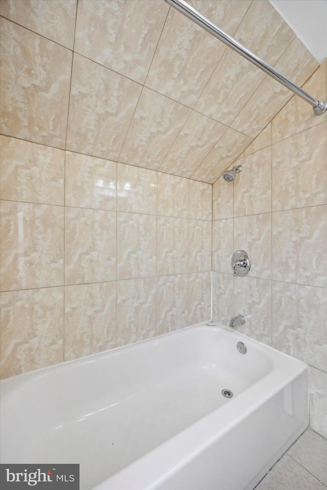 bathroom with tile walls