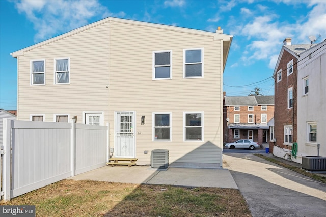 back of property featuring central air condition unit