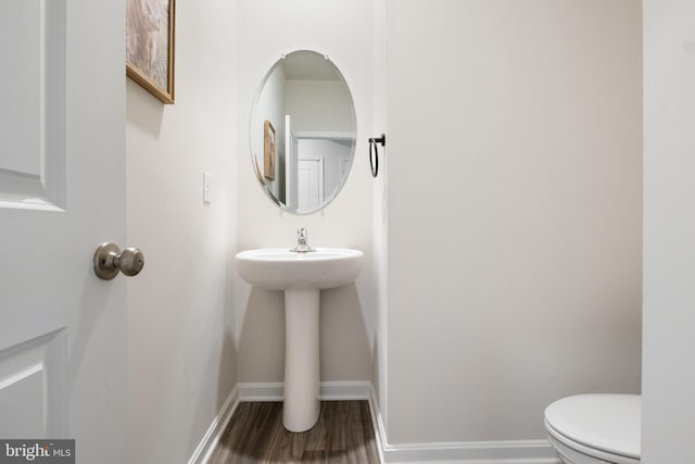143 Knobby Hook, Hanover, PA 17331 - half bath with toilet, wood finished floors, baseboards, and a sink